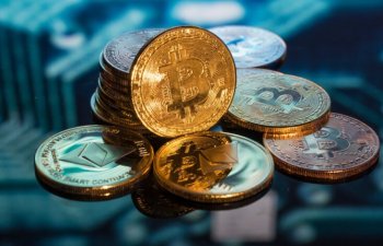 Qazlı içkidən Parisə qədər: kripto ödənişləri ilə real həyat